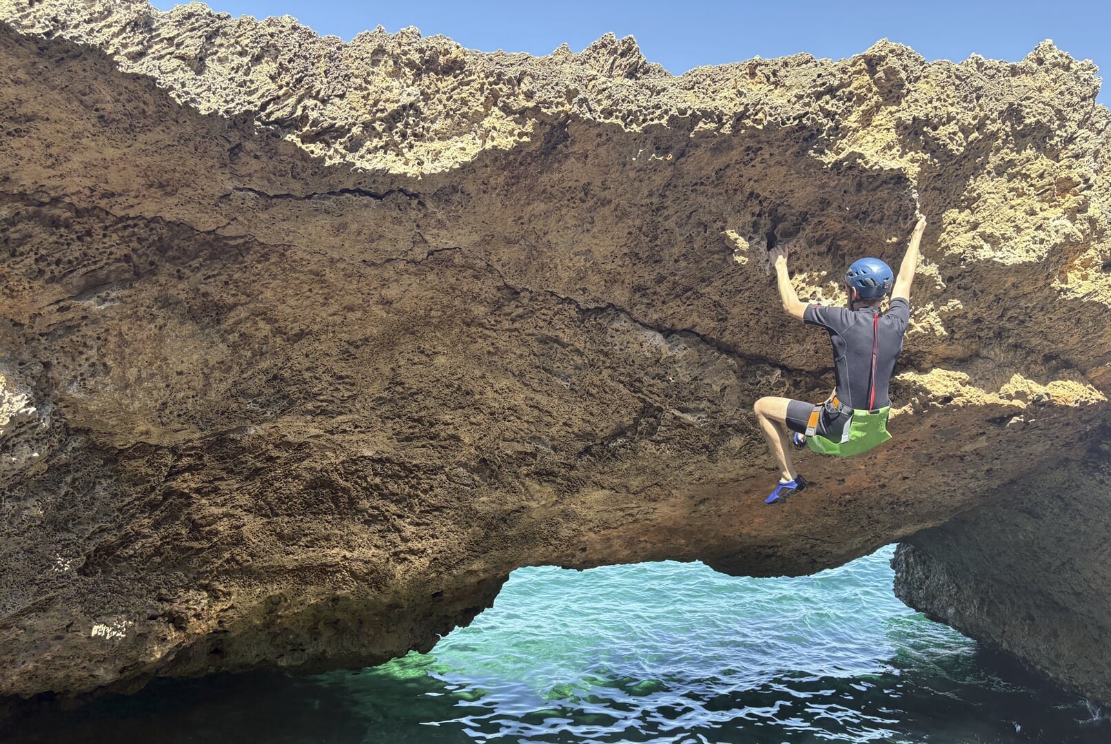 Deep water soloing during a coasteering tour in Alcudia